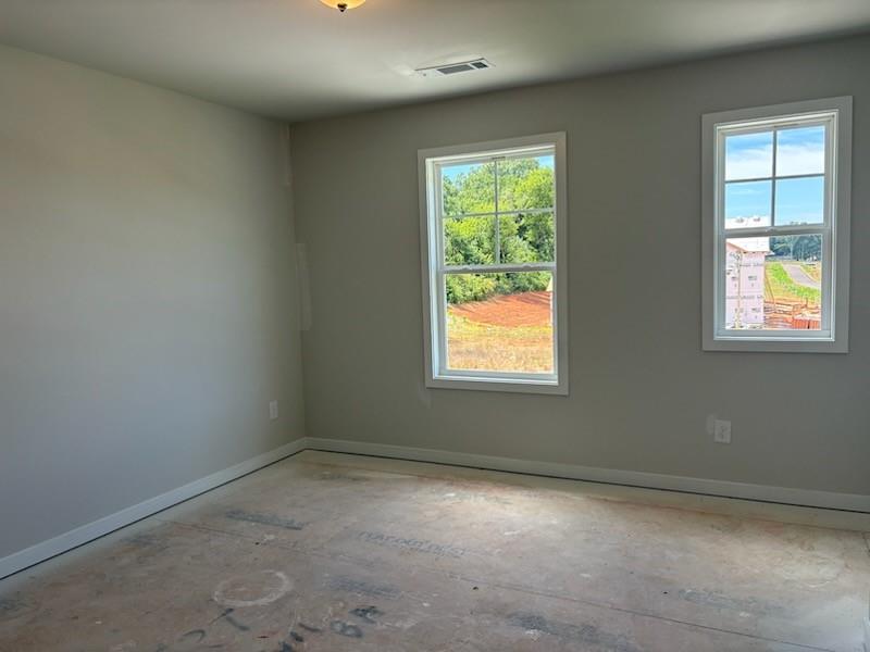 6 Commons Way Cartersville, GA 30120 - Photo 15 of 37 an empty room with a window