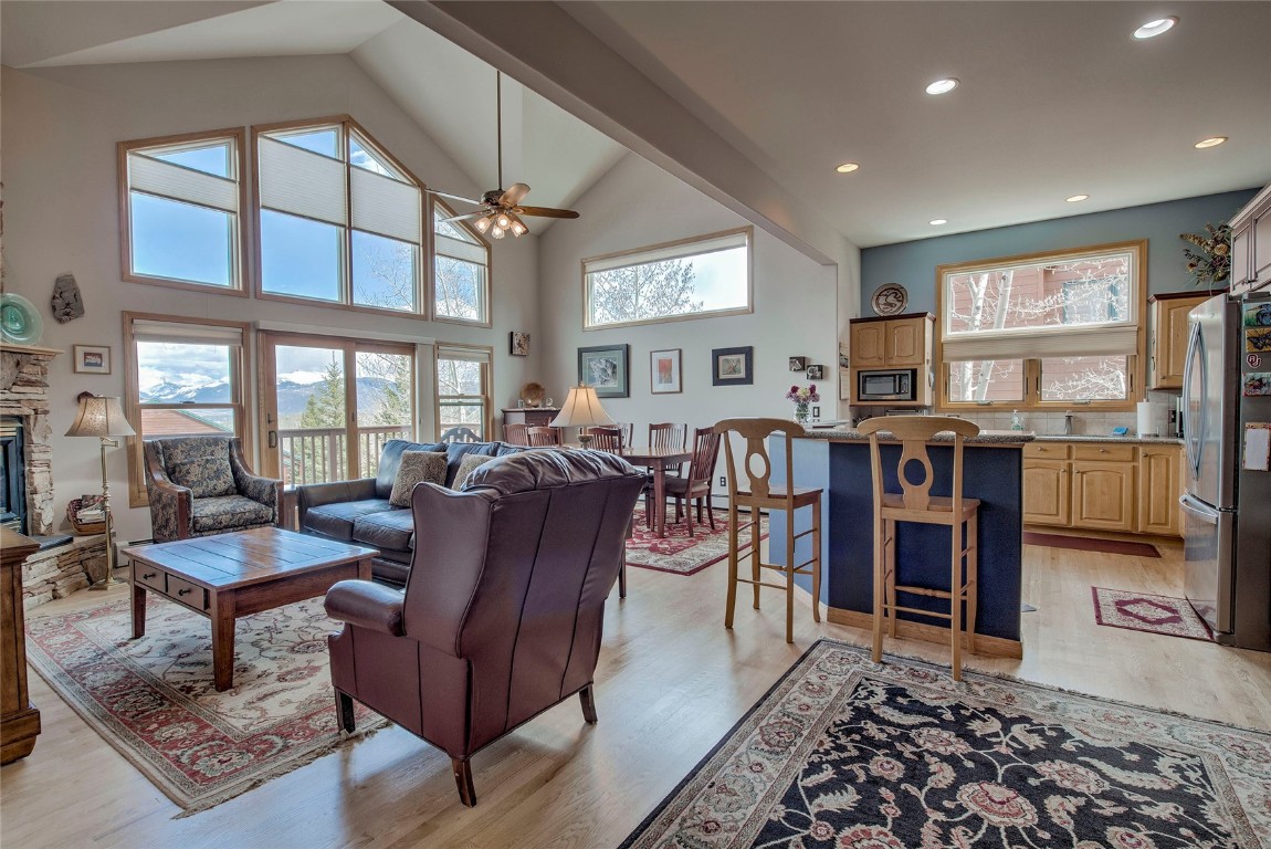 a living room with furniture a window and a bookshelf