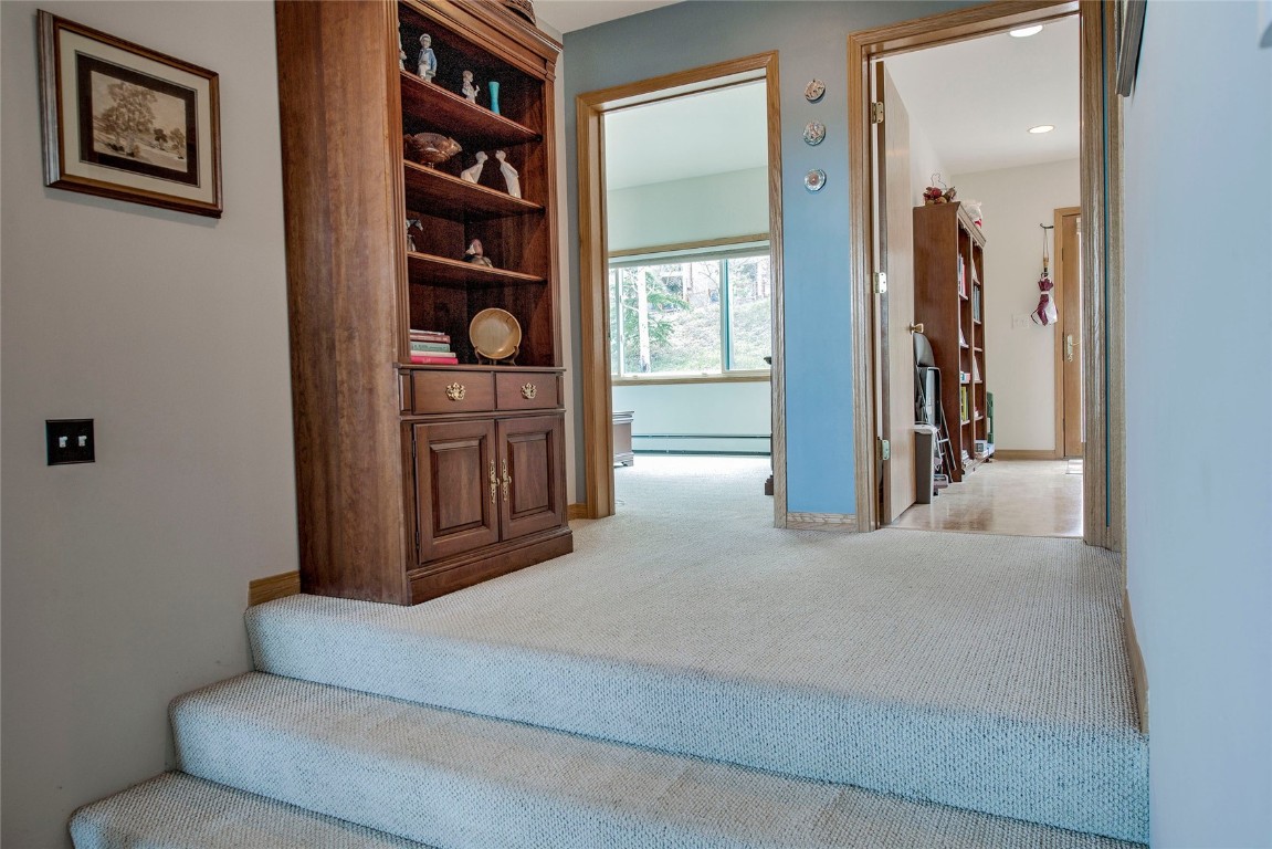 43 Lacy Drive Silverthorne, CO 80498 - Photo 12 of 35 a living room with furniture a ceiling fan and a window