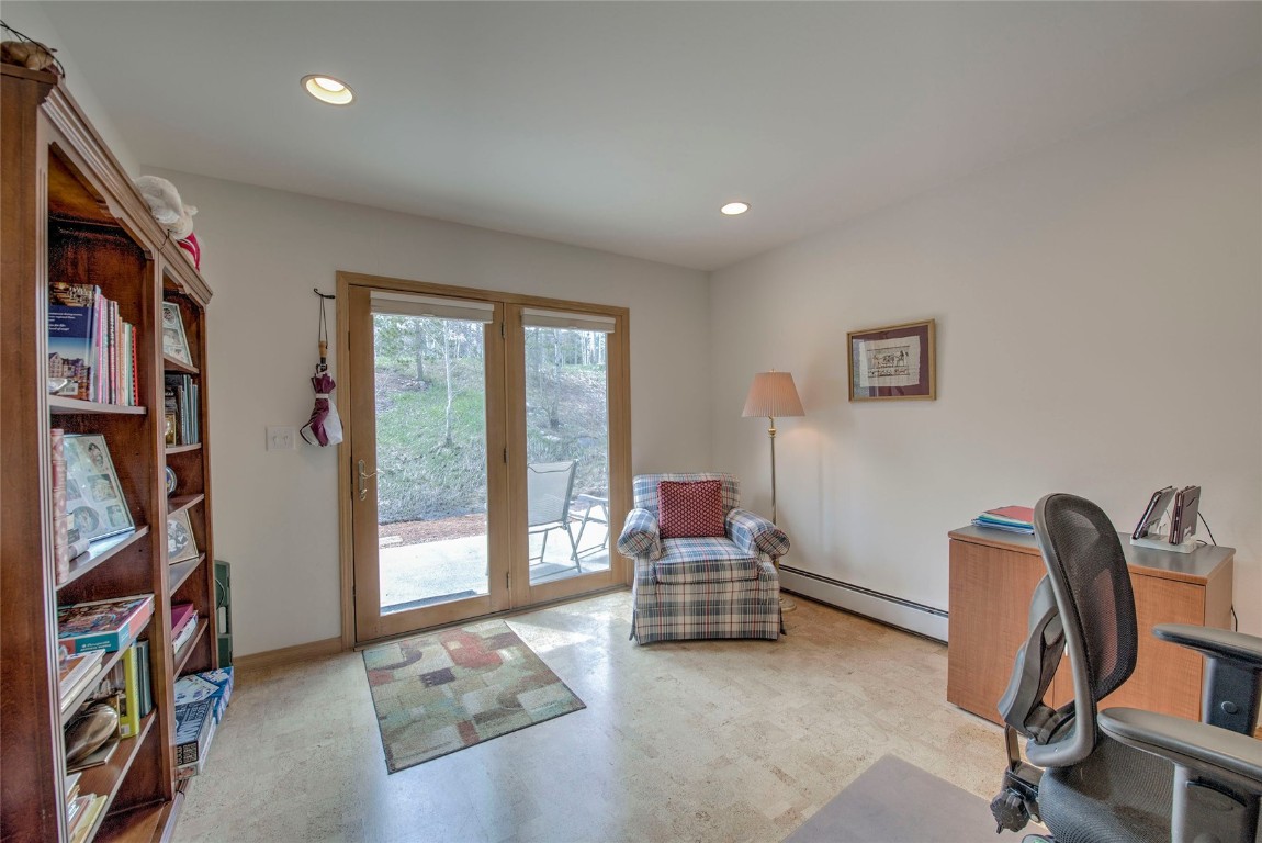 43 Lacy Drive Silverthorne, CO 80498 - Photo 16 of 35 a living room with furniture and a floor to ceiling window