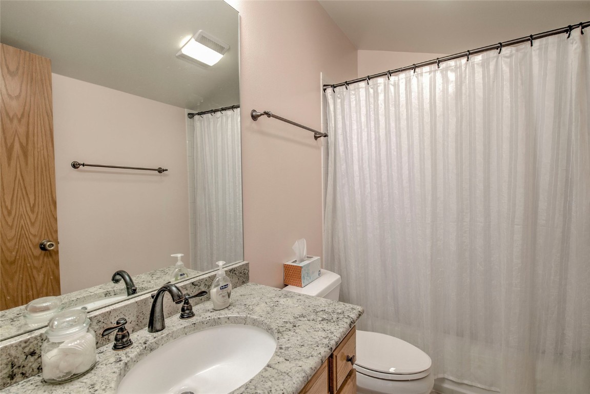 43 Lacy Drive Silverthorne, CO 80498 - Photo 25 of 35 a bathroom with a granite countertop sink toilet and shower