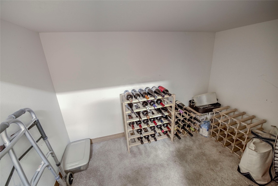 43 Lacy Drive Silverthorne, CO 80498 - Photo 28 of 35 a bedroom with a bed and a chair