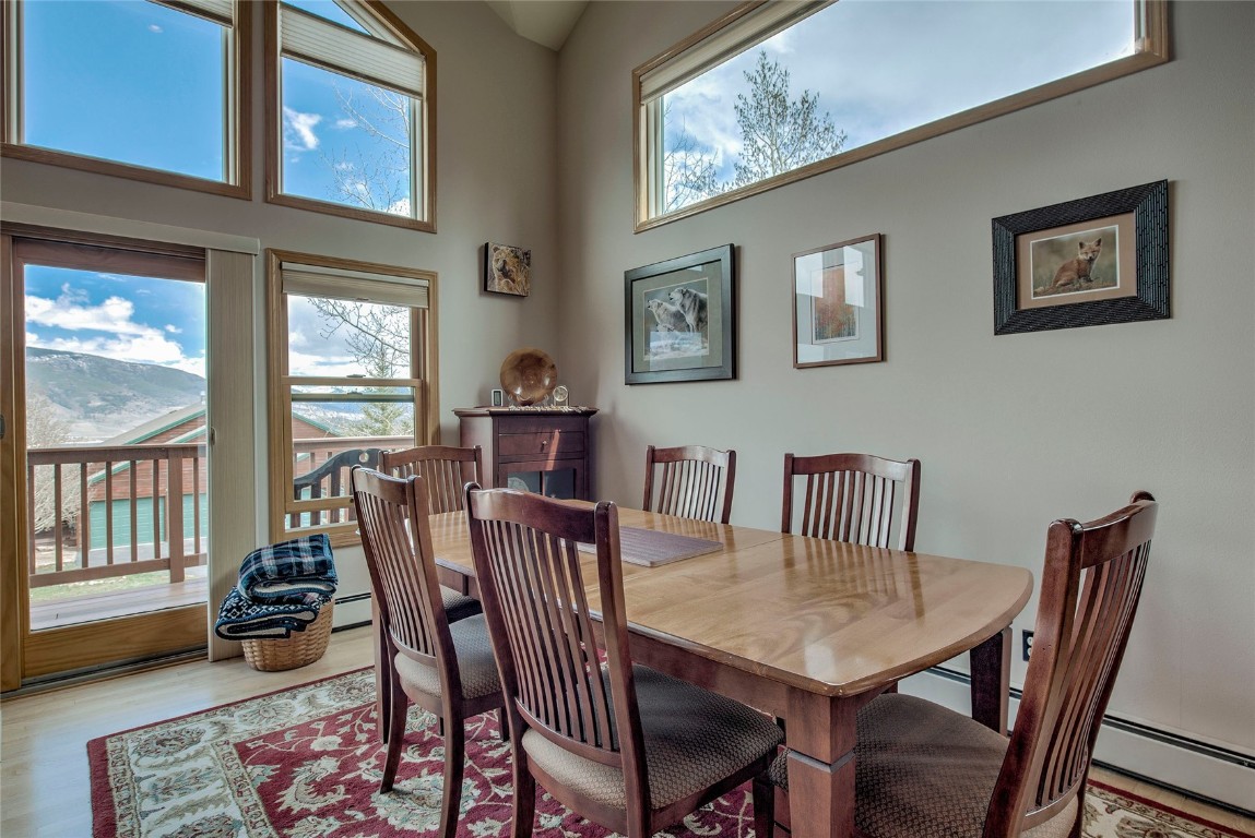 43 Lacy Drive Silverthorne, CO 80498 - Photo 8 of 35 a view of a dining room with furniture wooden floor and a rug