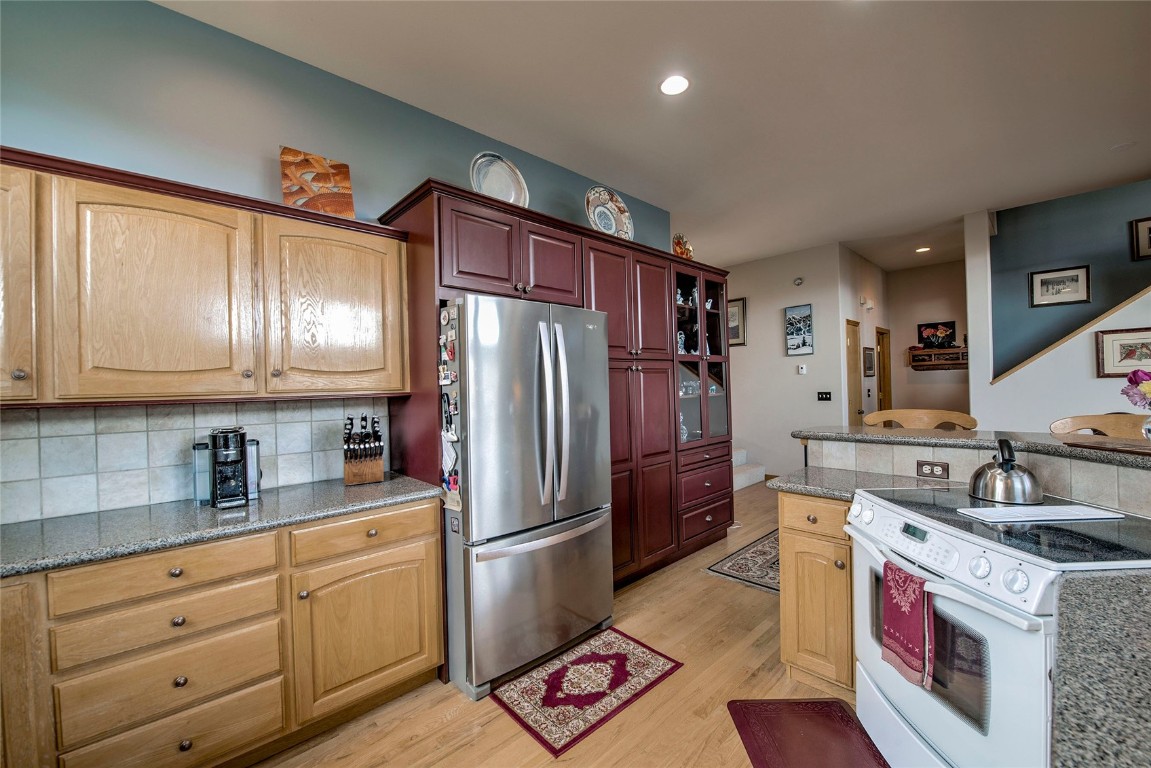 43 Lacy Drive Silverthorne, CO 80498 - Photo 10 of 35 a kitchen with granite countertop stainless steel appliances a refrigerator sink and cabinets
