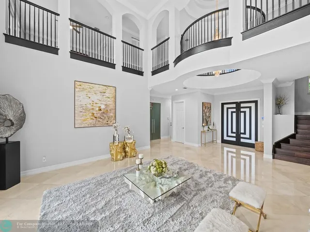 a bathroom with a toilet and a shower curtain