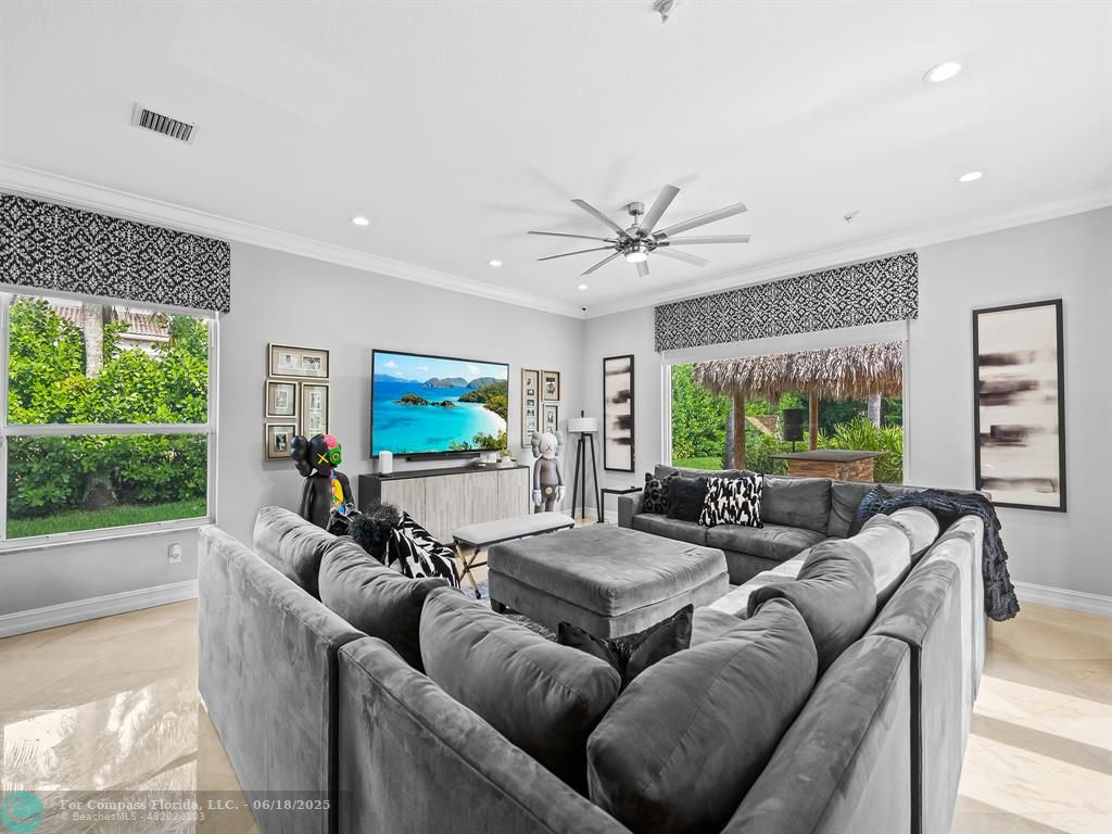 10741 Pine Lodge Trail Davie, FL 33328 - Photo 14 of 48 a living room with furniture a large window with kitchen view