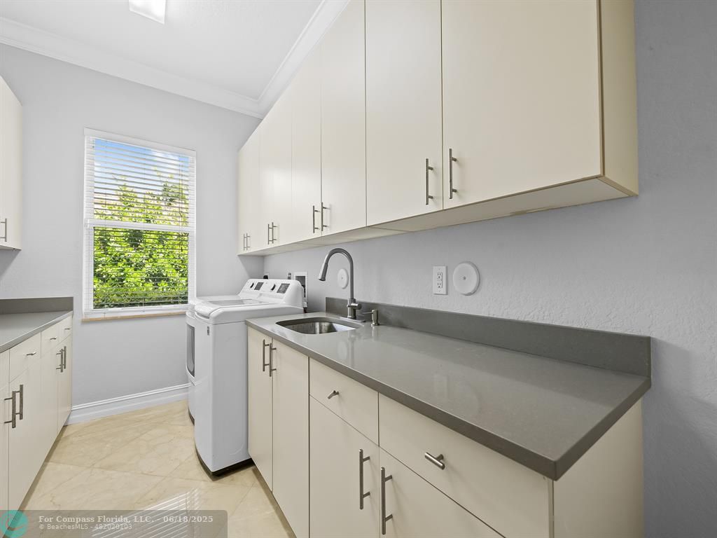 10741 Pine Lodge Trail Davie, FL 33328 - Photo 19 of 48 a kitchen with a sink cabinets and window