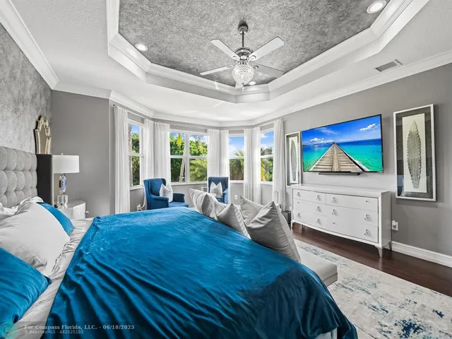a spacious bathroom with a tub sink and mirror