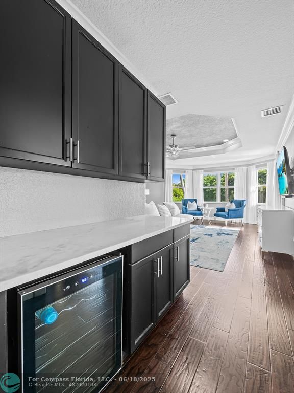 10741 Pine Lodge Trail Davie, FL 33328 - Photo 28 of 48 a kitchen with stainless steel appliances granite countertop a stove a sink and a microwave