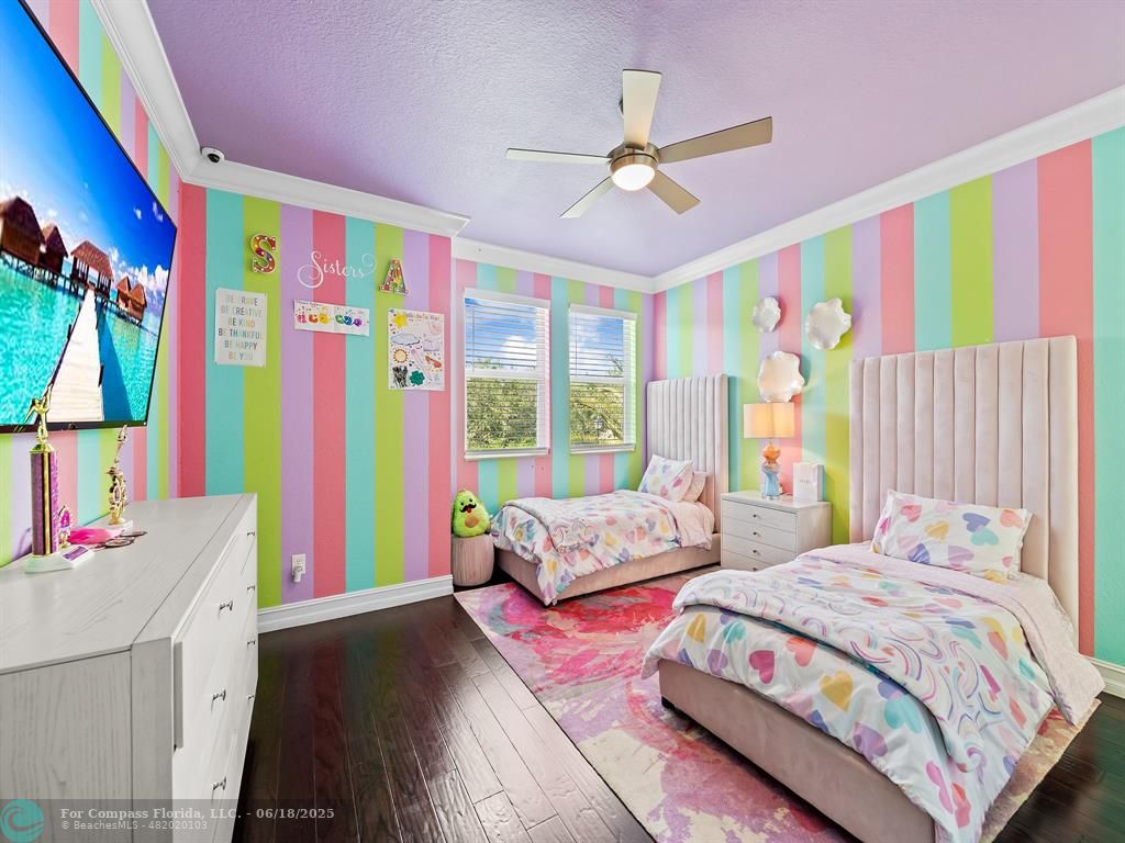 10741 Pine Lodge Trail Davie, FL 33328 - Photo 34 of 48 a bedroom with a bed painting on wall and a large window