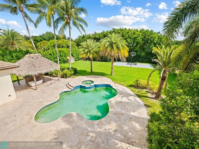 a view of a swimming pool with a patio