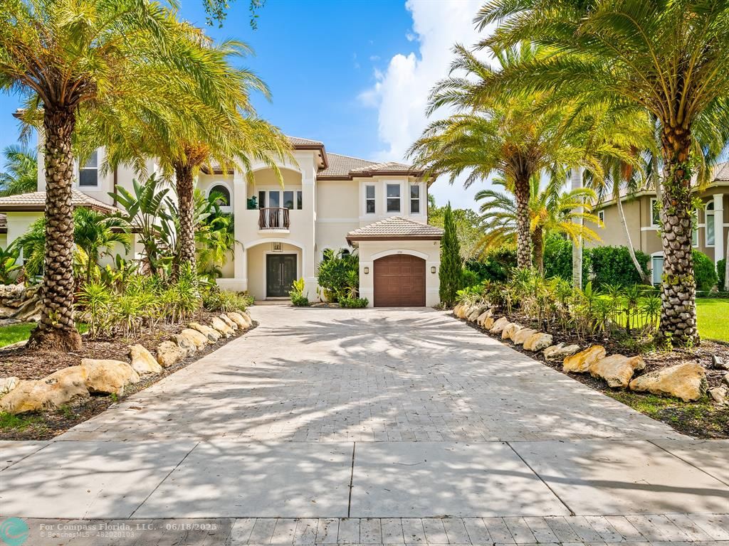 10741 Pine Lodge Trail Davie, FL 33328 - Photo 41 of 48 a front view of a house with a yard and garage