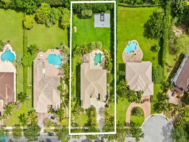 a view of a house with backyard porch and sitting area