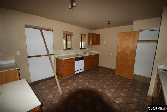 475 Hoge Road Reno, NV 89506 - Photo 4 of 9 a view of a kitchen with refrigerator and wooden floor