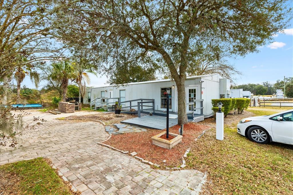 10973 Highway 301 Oxford, FL 34484 - Photo 7 of 17 a view of a parking space in the backyard of a house
