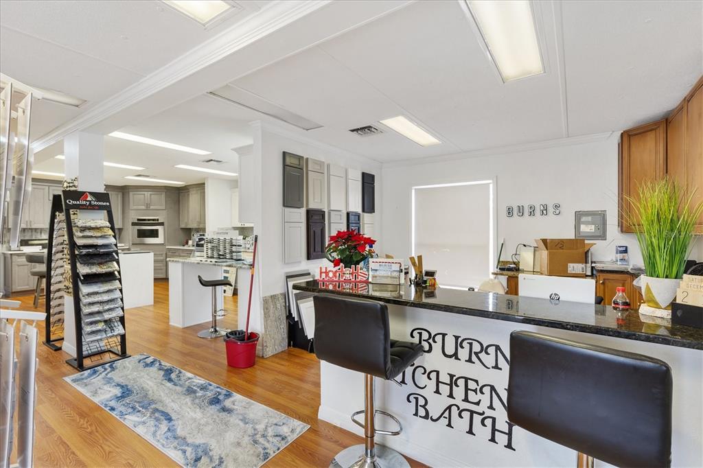 10973 Highway 301 Oxford, FL 34484 - Photo 9 of 17 a living room with furniture and a flat screen tv