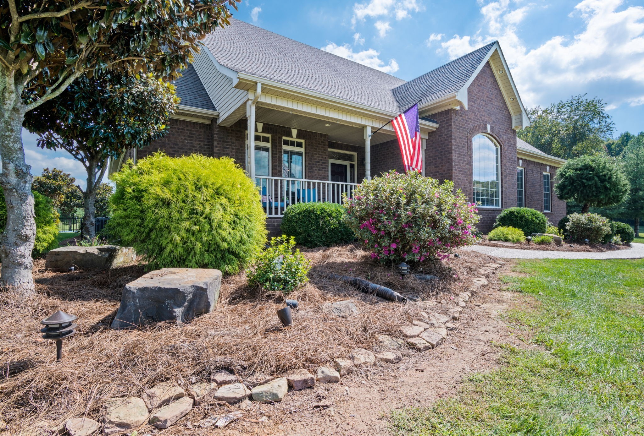 4717 Mt Zion Road Springfield, TN 37172 - Photo 3 of 34 a view of a house with a small yard and floor to ceiling window and potted plants