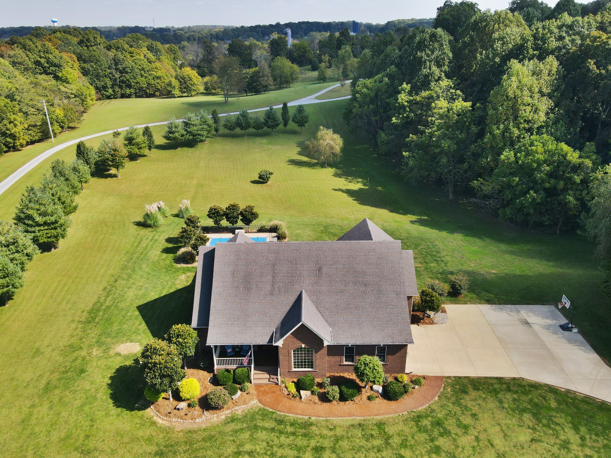 4717 Mt Zion Road Springfield, TN 37172 - Photo 29 of 34 an aerial view of a house with swimming pool patio and lake view