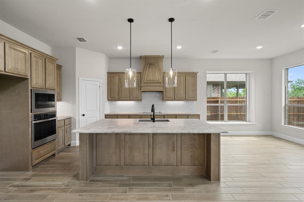 705 Seahawk Street Joshua, TX 76058 - Photo 4 of 28 DFW-Mockingbird Hills-Concept 3473-705 Seahawk Street-Kitchen-Risewell Homes-1