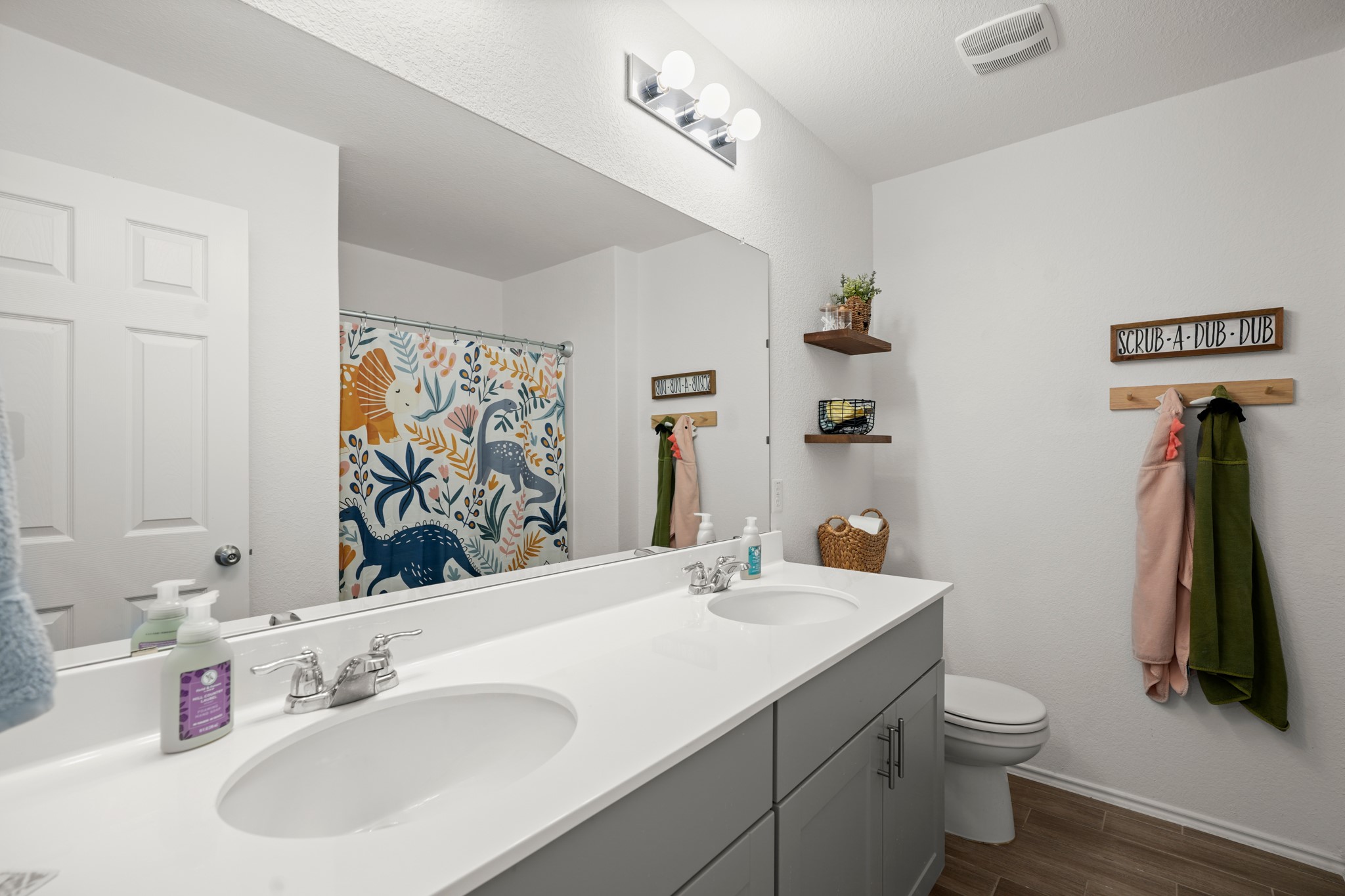 500 Pickrell Loop Georgetown, TX 78628 - Photo 19 of 29 a bathroom with a sink vanity and toilet