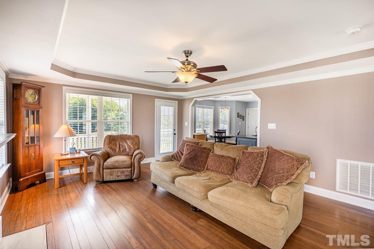 407 Ina Joe Place Willow Spring, NC 27592 - Photo 3 of 26 a living room with furniture and a large window