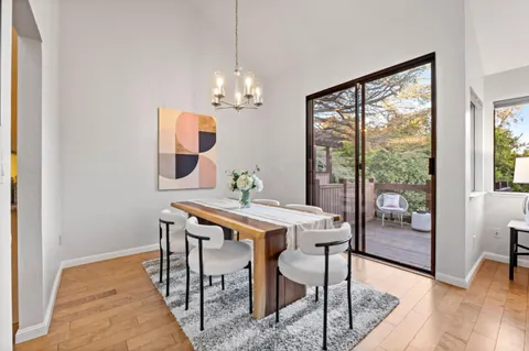 a bedroom with furniture and a large window