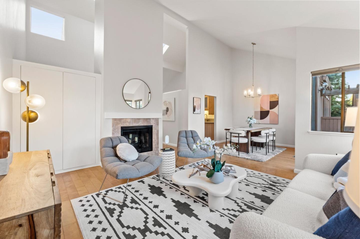 1631 Grant Road Mountain View, CA 94040 - Photo 19 of 51 a living room with furniture a fireplace and wall paintings