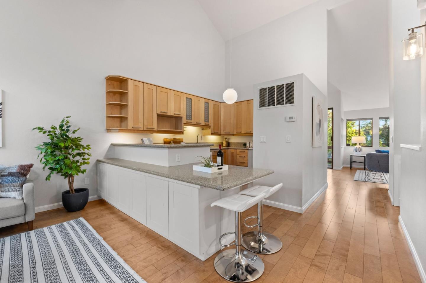 1631 Grant Road Mountain View, CA 94040 - Photo 23 of 51 a kitchen with furniture a counter space and wooden floor