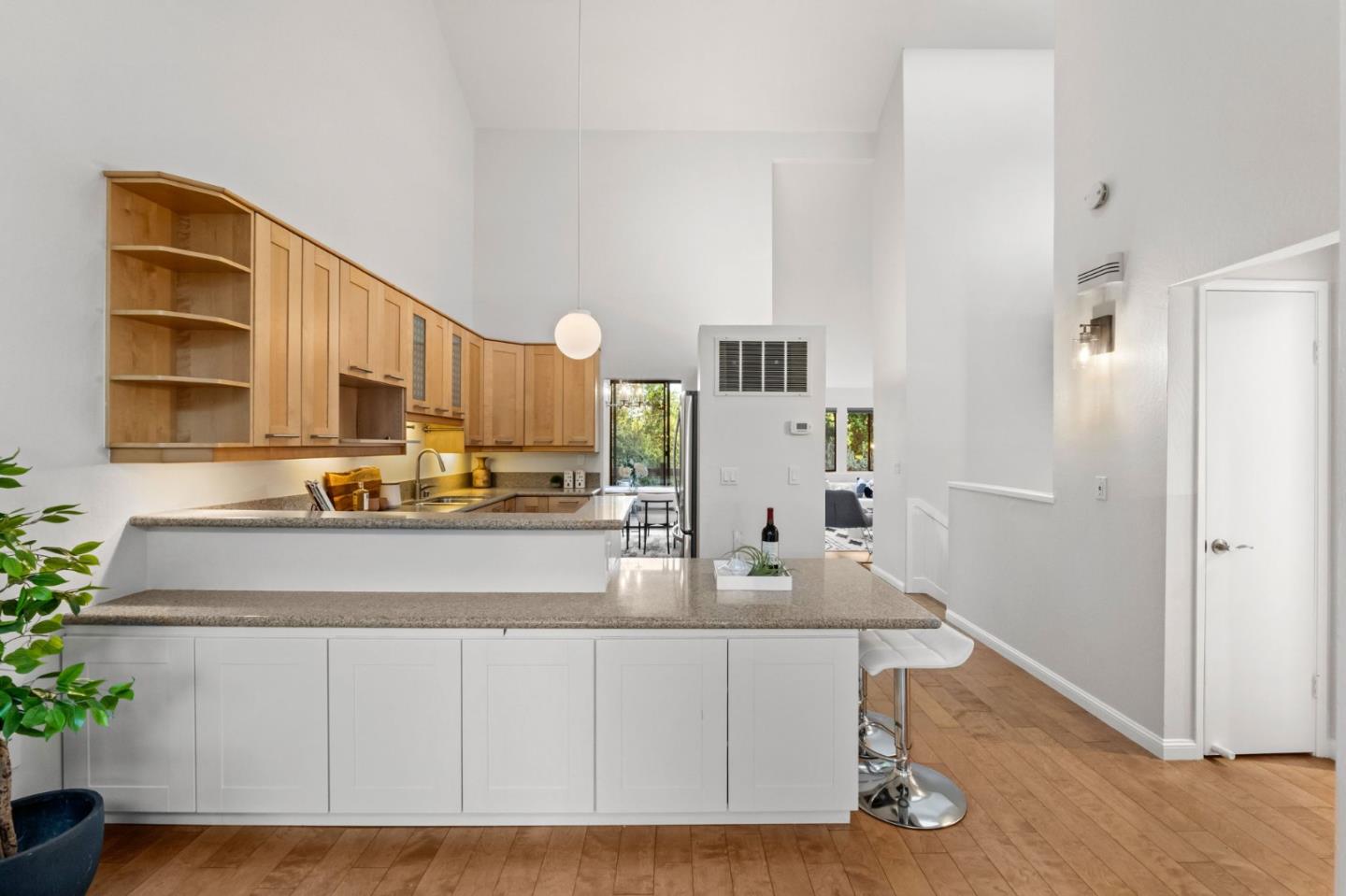 1631 Grant Road Mountain View, CA 94040 - Photo 24 of 51 a kitchen with a sink cabinets and wooden floor