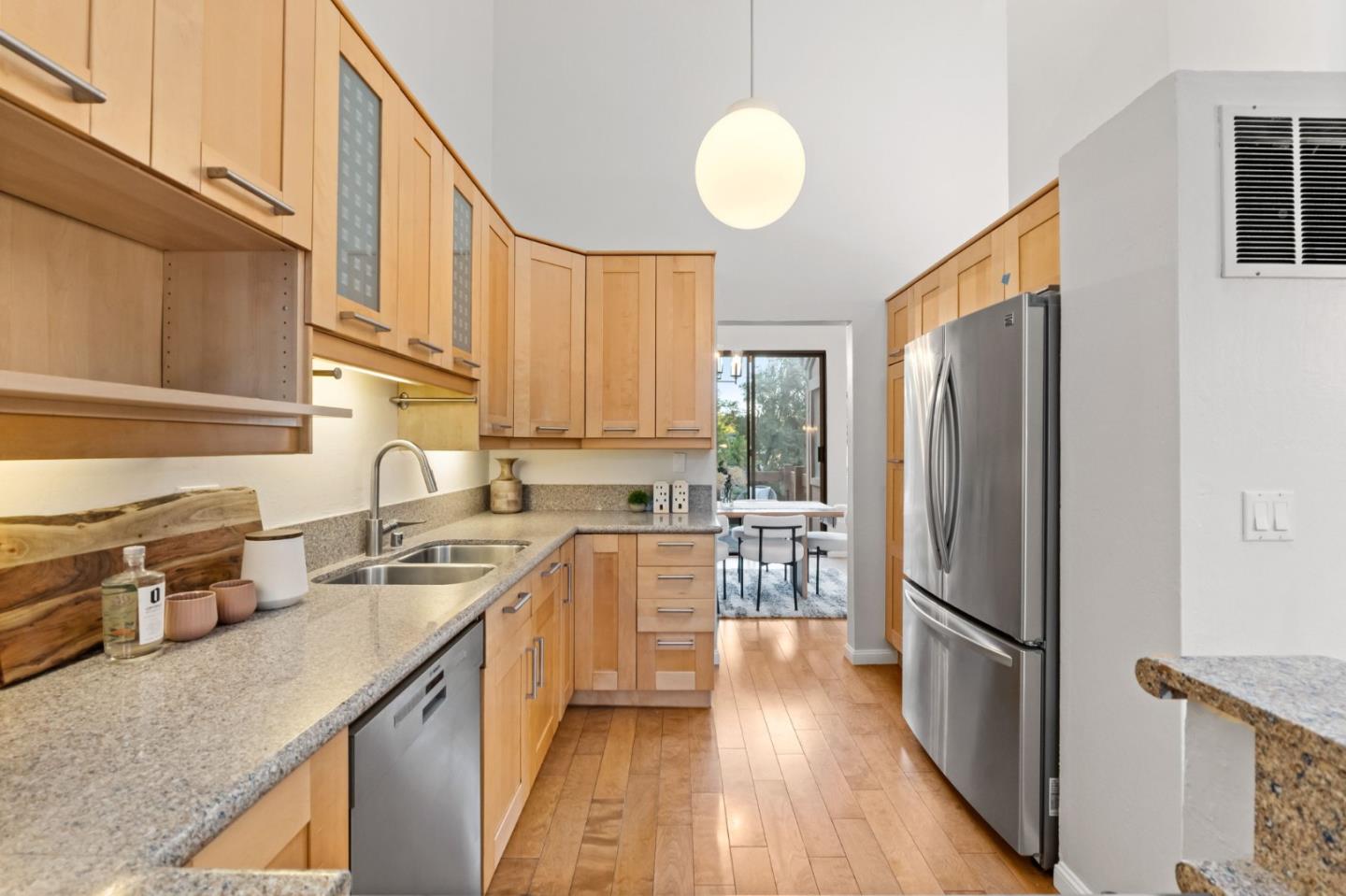 1631 Grant Road Mountain View, CA 94040 - Photo 28 of 51 a kitchen with stainless steel appliances granite countertop a refrigerator a stove a sink and a microwave
