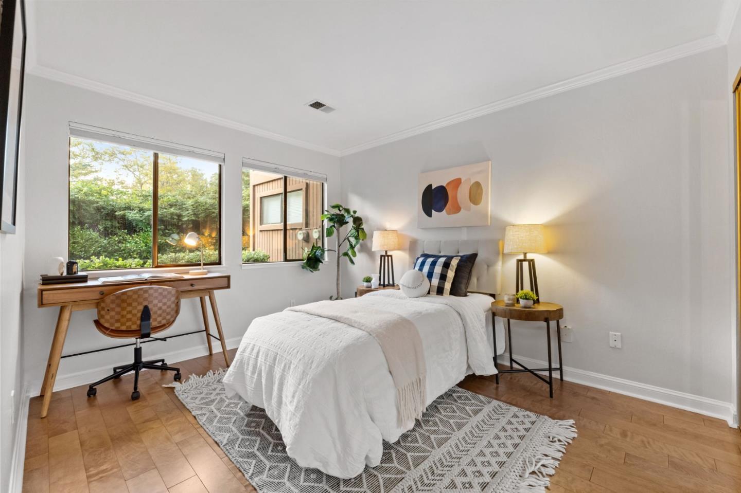 1631 Grant Road Mountain View, CA 94040 - Photo 33 of 51 a bedroom with a bed and a large window