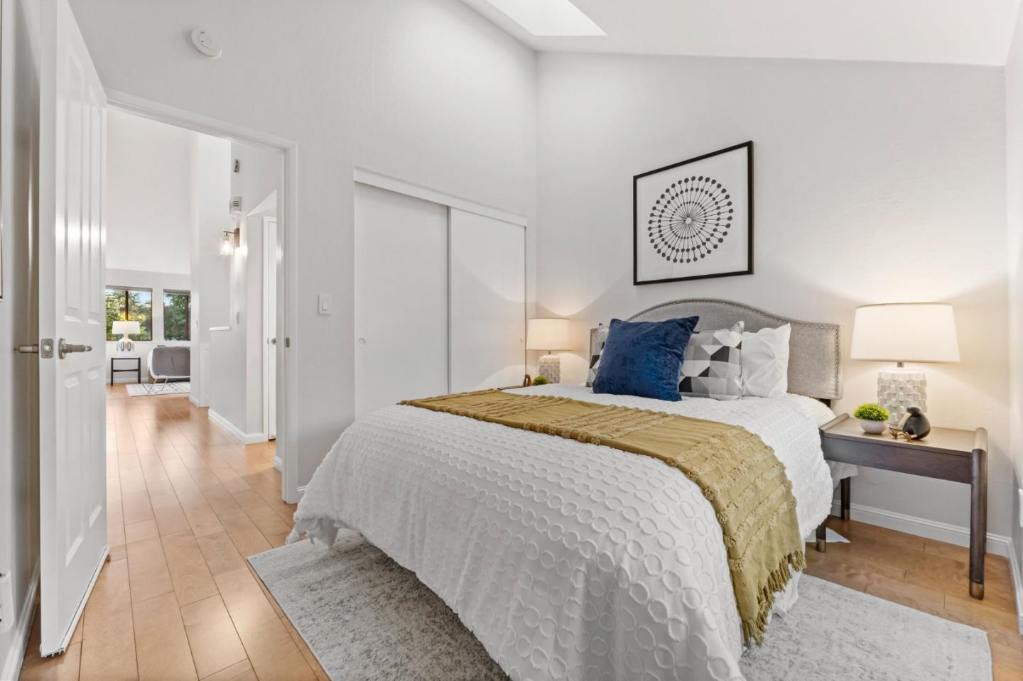 1631 Grant Road Mountain View, CA 94040 - Photo 36 of 51 a bedroom with a large bed and paintings on the wall