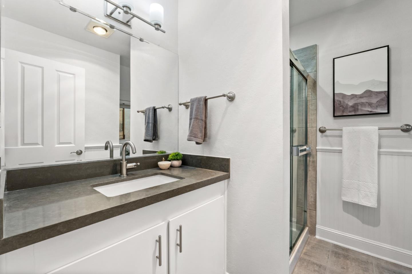 1631 Grant Road Mountain View, CA 94040 - Photo 40 of 51 a bathroom with a sink and a mirror