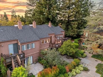 a aerial view of a house with a yard and garden