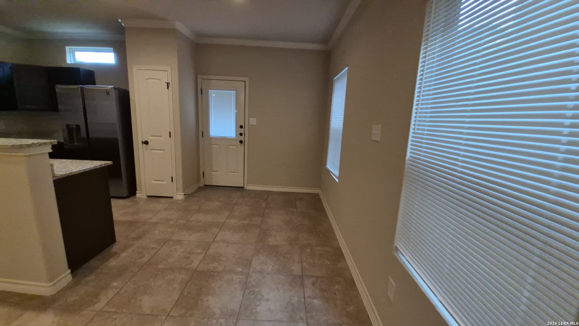 6414 Luglio Lane, Unit 101 San Antonio, TX 78233 - Photo 4 of 23 a view of a kitchen from a hallway