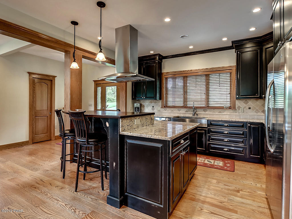 419 Bare Valley Road Montrose, PA 18801 - Photo 11 of 72 a kitchen with stainless steel appliances granite countertop a stove and a kitchen island