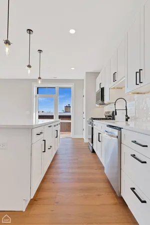 a large kitchen with cabinets