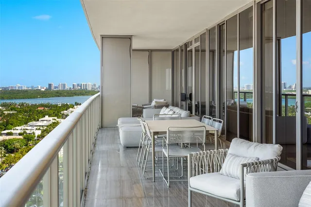a view of a living room and floor to ceiling window or an outdoor dining room
