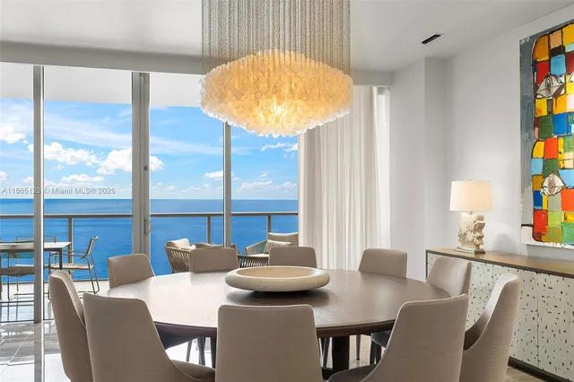 a view of a dining room with furniture and window