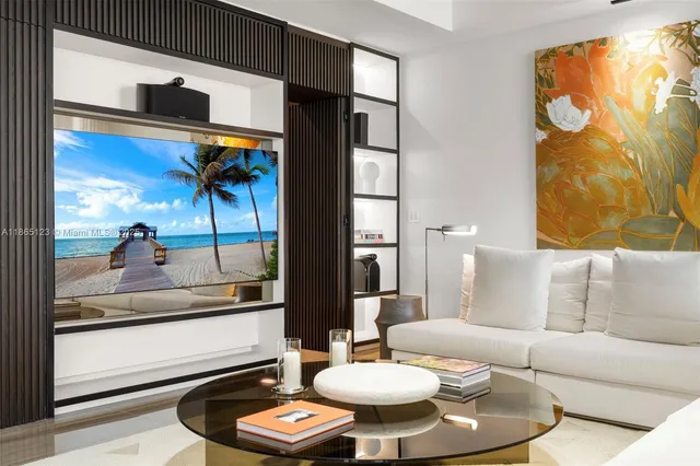 a living room with furniture and a floor to ceiling window