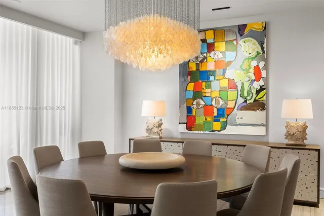 a view of a dining room with furniture and a window