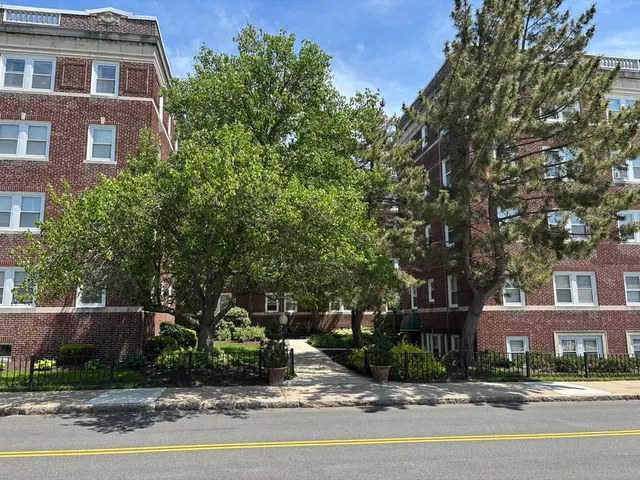 a front view of a building with street view