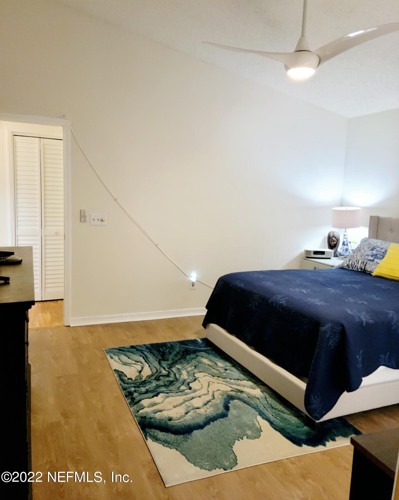 5425 Spring Brook Road Jacksonville, FL 32277 - Photo 19 of 35 a bedroom with a bed window and dresser