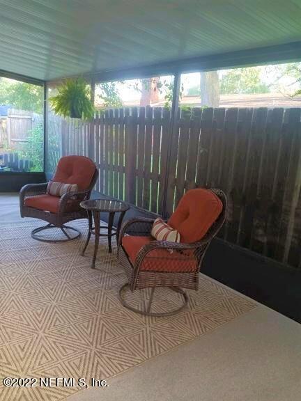 5425 Spring Brook Road Jacksonville, FL 32277 - Photo 27 of 35 a outdoor living space with furniture and a large window