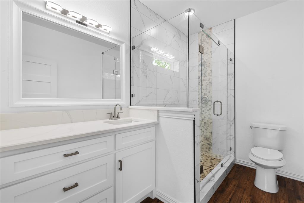 709 South Church Street Decatur, TX 76234 - Photo 14 of 14 a bathroom with a sink a toilet and shower