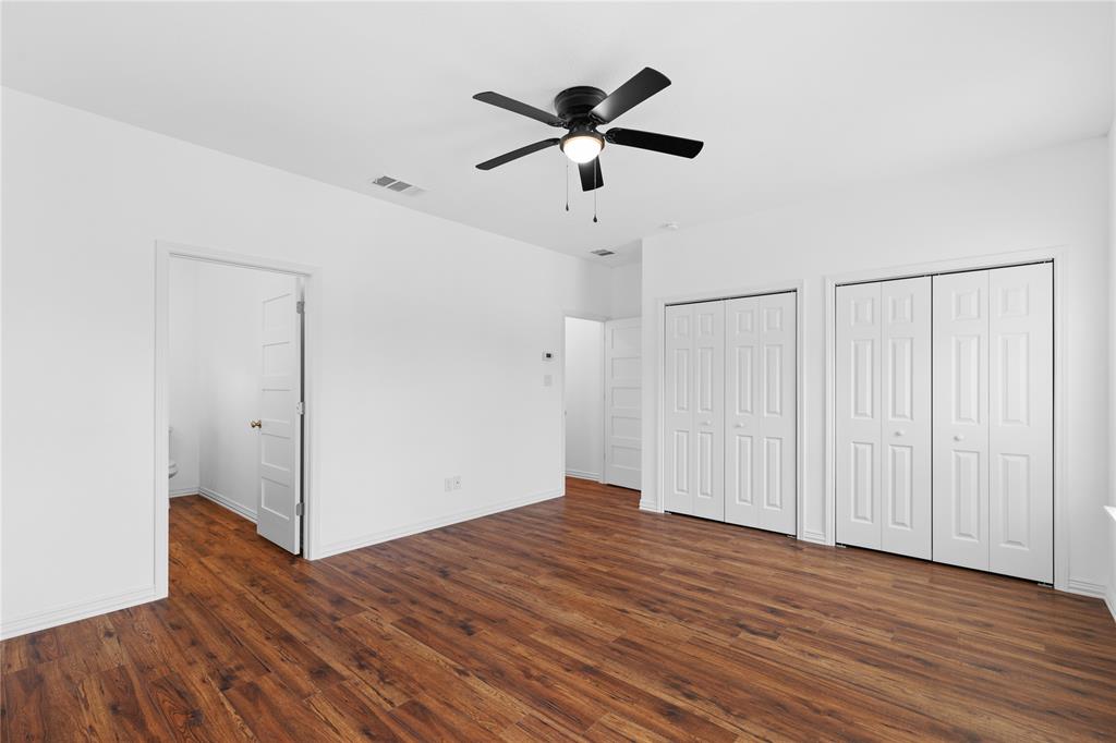 709 South Church Street Decatur, TX 76234 - Photo 7 of 14 a view of empty room with wooden floor