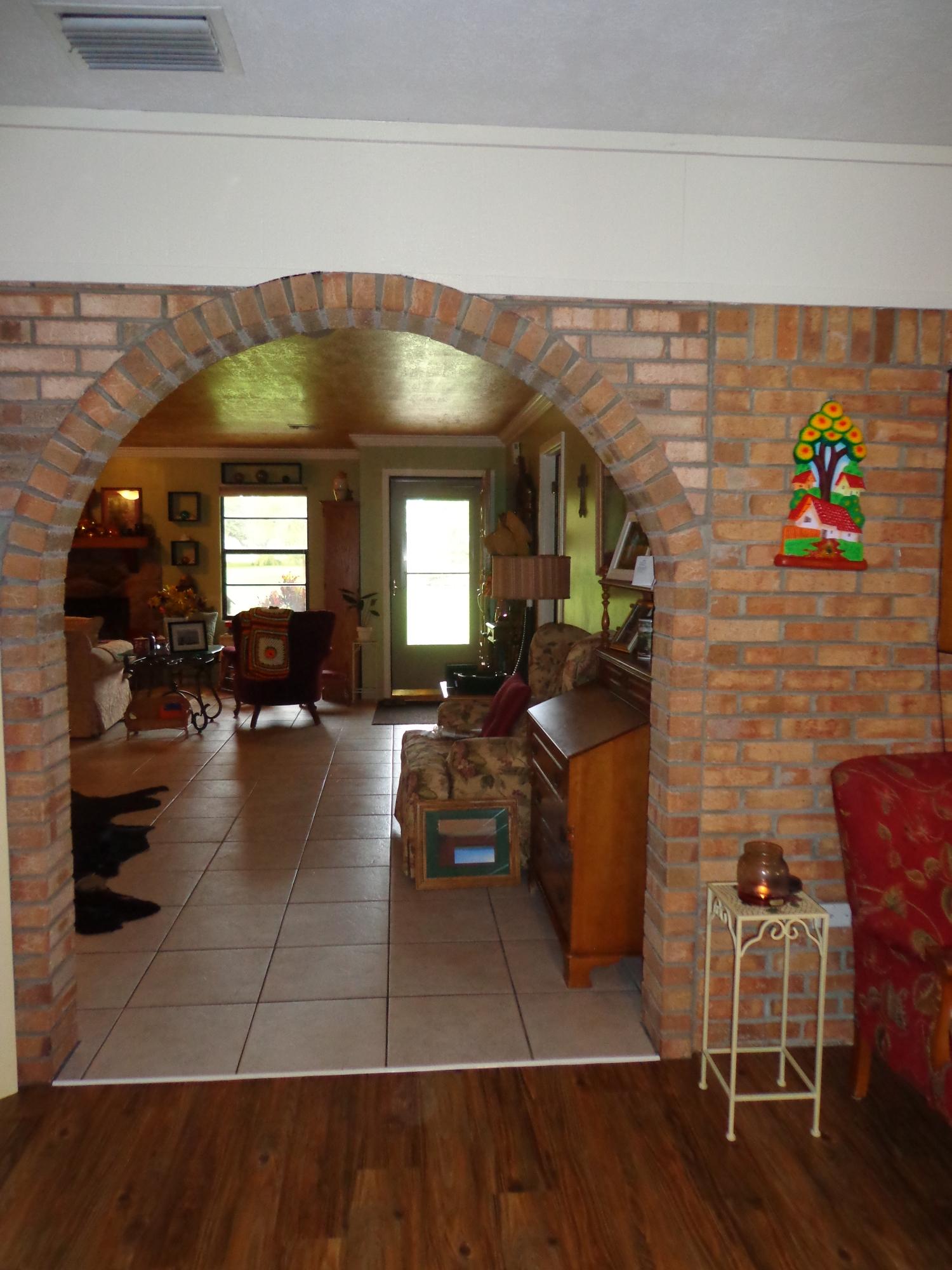 2001 South Brocksmith Road Fort Pierce, FL 34945 - Photo 12 of 24 Bricked archway into living rooms