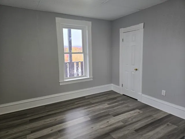 a view of room with hardwood floor