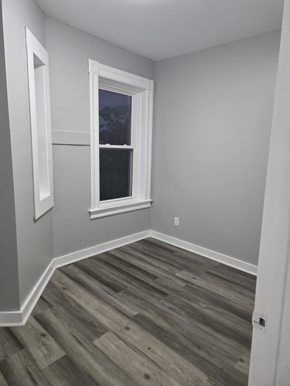123 Walnut Street, Unit 4L Holyoke, MA 01040 - Photo 5 of 16 a view of an empty room with wooden floor and a window
