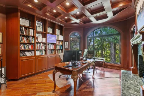a view of living room filled with furniture and a fireplace